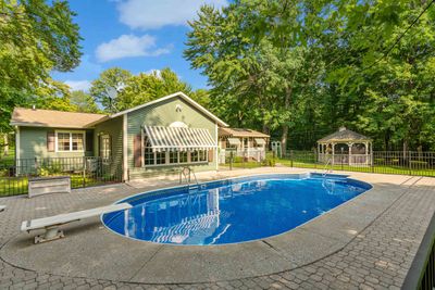 Sunroom/Family Room with Otter Creek Awnings &amp; Anderson Windows. Pool is fenced in | Image 2