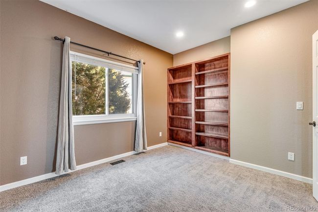 Office space with baseboards, a textured wall, recessed lighting, visible vents, and carpet | Image 19