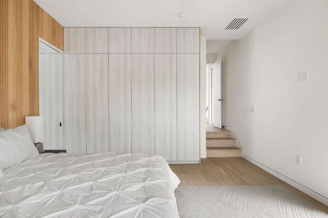 Bedroom featuring wood finished floors | Image 16