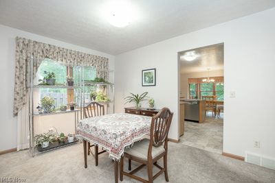 Dining space and light colored carpet | Image 3