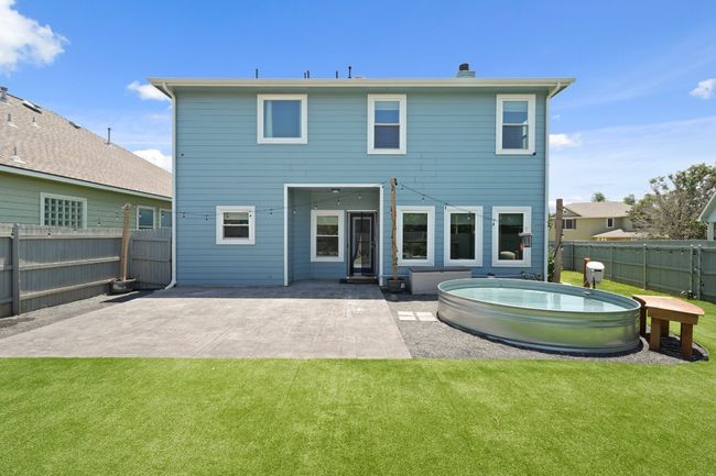 Rear view of property featuring a patio area and a chimney | Image 6