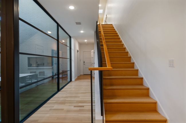 Stairs with baseboards, wood finished floors, and recessed lighting | Image 13