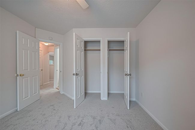 One of three secondary bedrooms upstairs, featuring closet space, all new carpet, and freshly painted walls and ceiling. | Image 33