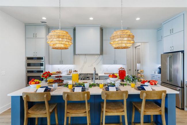 Kitchen featuring Custom Cabinets Deluxe 1” Slim Shaker overlay cabinetry. | Image 13
