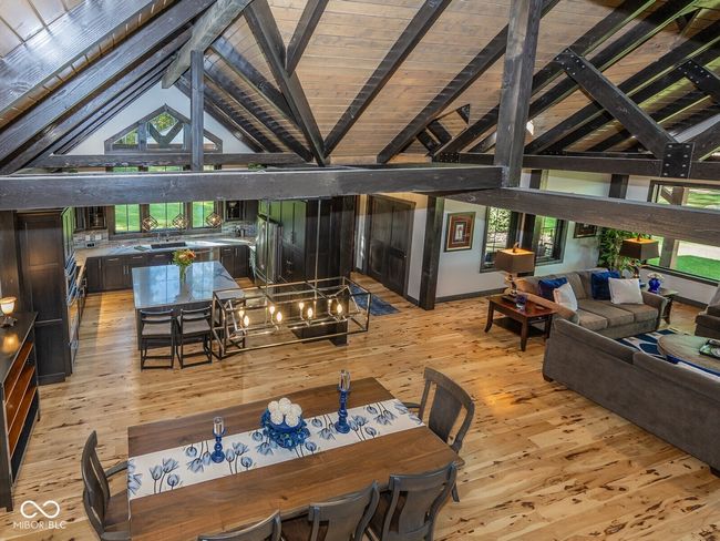 dining space featuring light wood-style flooring and wooden ceiling | Image 11