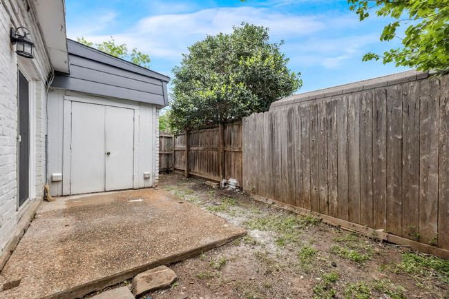 View of fenced backyard | Image 19