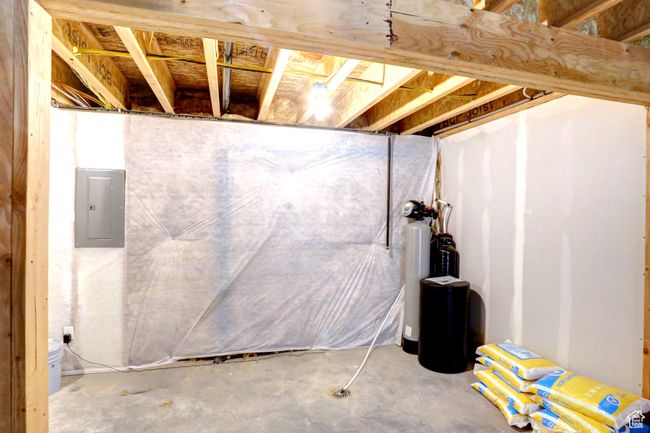 Unfinished below grade area featuring electric panel | Image 24