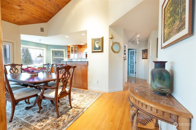 View from the entry and dining room toward the main floor Primary bedroom | Image 22