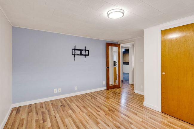 Empty room featuring baseboards, light wood-style floors, and a baseboard radiator | Image 30