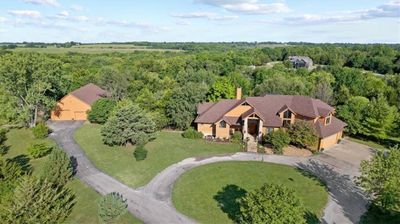 20.12 acres of land with home and outbuilding nestled into the trees | Image 1