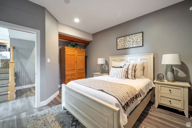Bedroom with baseboards, recessed lighting, wood finished floors, and a closet | Image 27