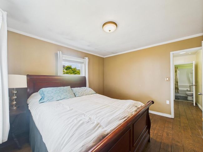 Bedroom featuring dark wood-type flooring and ornamental molding | Image 22