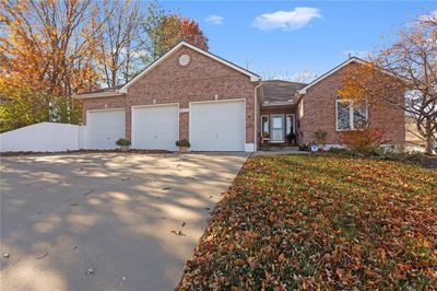 View of front facade with a garage | Image 1