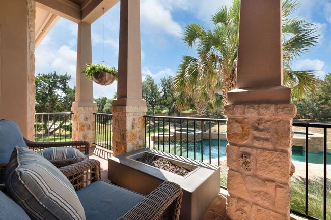 View of patio featuring an outdoor fire pit | Image 31