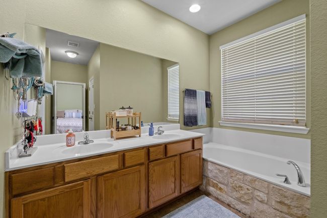 Ensuite bathroom with a sink, a bath, and double vanity | Image 23