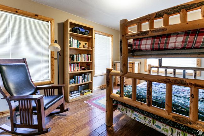 Bedroom featuring hardwood / wood-style flooring and baseboards | Image 20