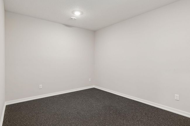 No need to join the gym as this space in the lower level is dedicated for exercise equipment with rubber flooring and TV bracket | Image 41