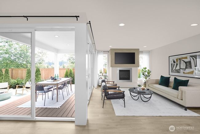Great Room lined by oversized doors providing access to the Signature Outdoor Room. Facade, Ext Colors, Interior Photos & Floor Plans for illustrative purposes only. Actual Facade, Ext Colors, Interiors & Floor Plans may differ. | Image 5