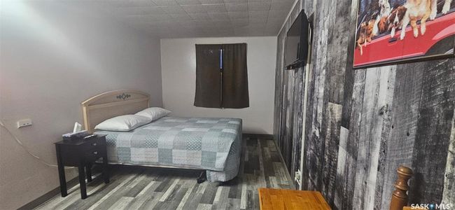Bedroom with wood finished floors | Image 27