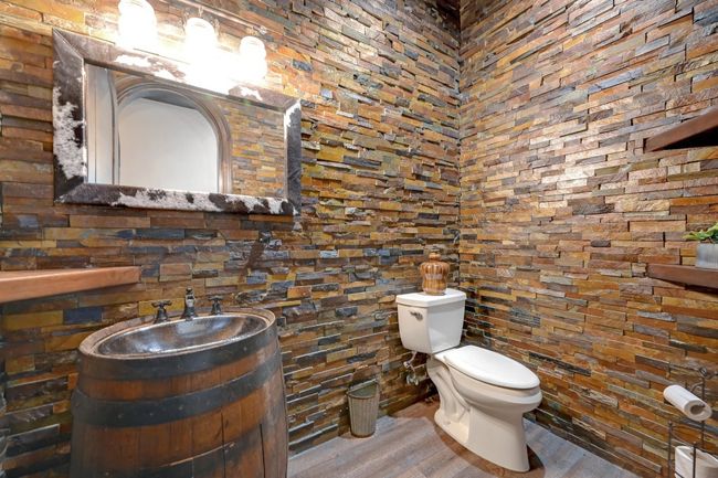 Bathroom featuring toilet, vanity, and wood finished floors | Image 29