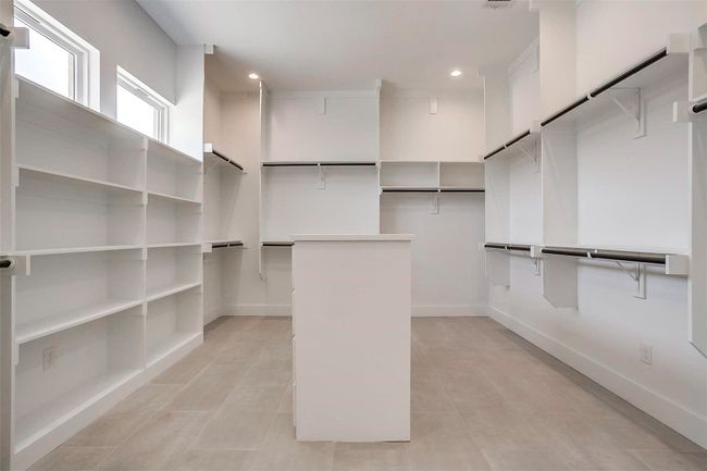 Walk in closet featuring light tile patterned floors | Image 28