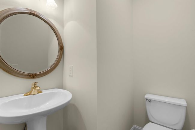 Bathroom featuring toilet and a sink | Image 28