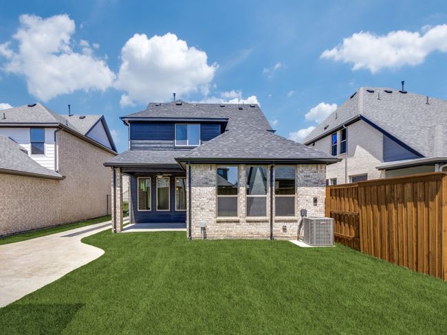 The entire family will enjoy plenty of fun outdoor gatherings in this lovely fenced back yard with covered patio. | Image 18