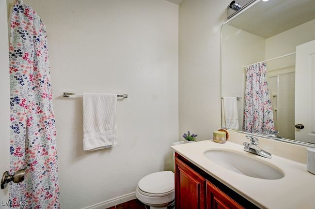 Bathroom featuring vanity and a shower with curtain | Image 16