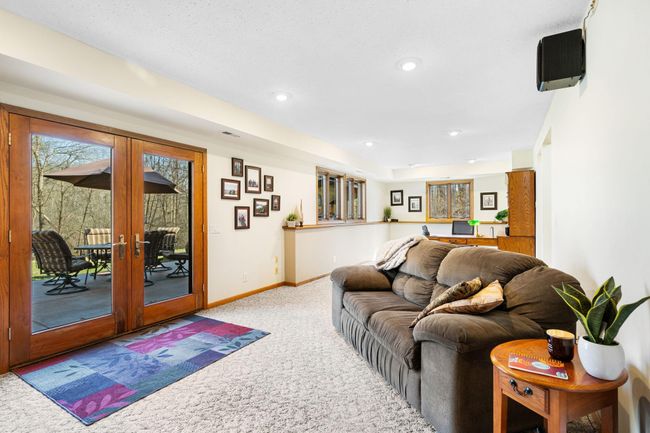 The large family room has plenty of room to entertain, and extends on to the back patio. | Image 21