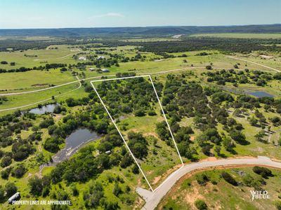 Birds eye view of property featuring a rural view and a water view | Image 1