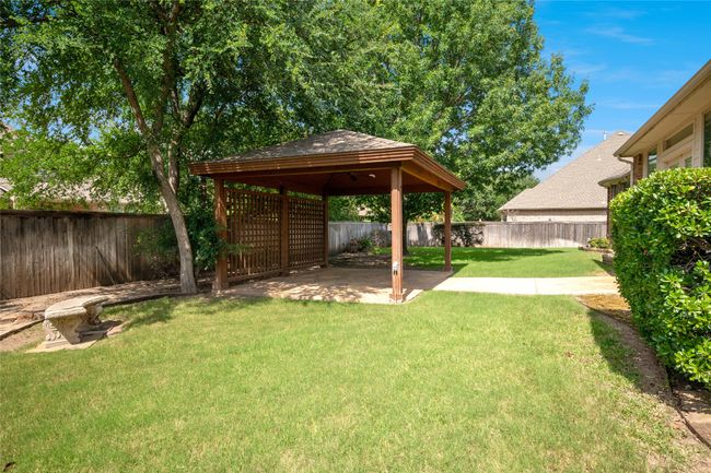 Fenced backyard with a gazebo and lots of room to run around. | Image 36