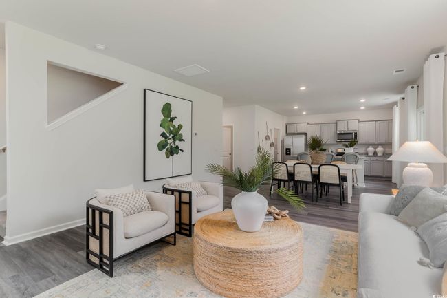 Living room featuring wood finished floors, recessed lighting, and baseboards | Image 14
