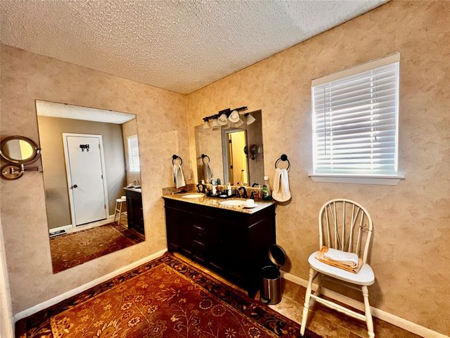 Bathroom with vanity and a textured ceiling | Image 12