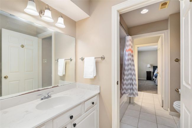 Each side of the Jack-and-Jill bath includes its own private toilet and tub/shower combo, creating a thoughtful, functional layout that supports smooth routines and guest comfort alike. | Image 29