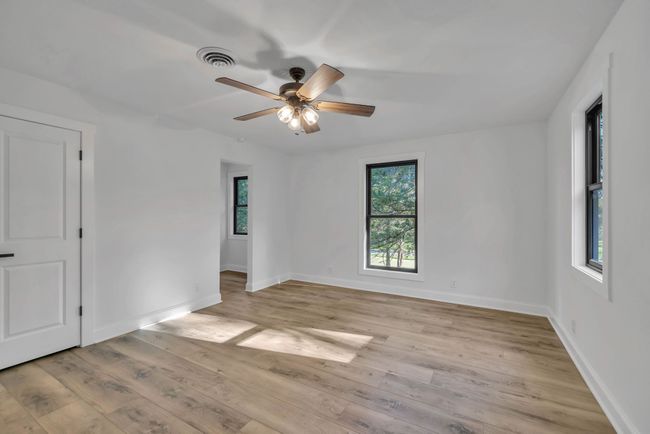 Another angle of this large bonus room upstairs. There is a nook in this room perfect for reading, a computer desk, storage, or anything you may need to use it for. | Image 32