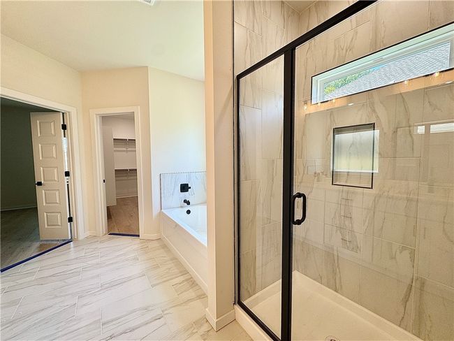 Large walk in tile shower and tub | Image 13