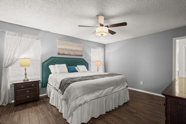 The primary bedroom is a retreat, spacious and serene, with plenty of room to unwind and make it your own private oasis, designed for ultimate comfort | Image 16
