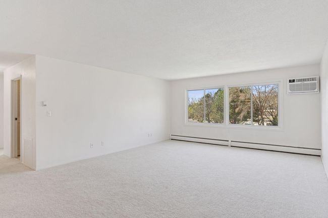 Updated living room with new carpet and new 10, 000 BTU AC in April 2025! | Image 7