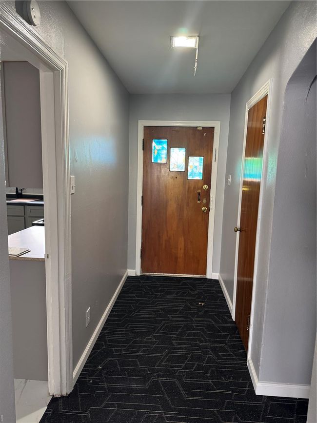 Doorway featuring baseboards and a sink | Image 10