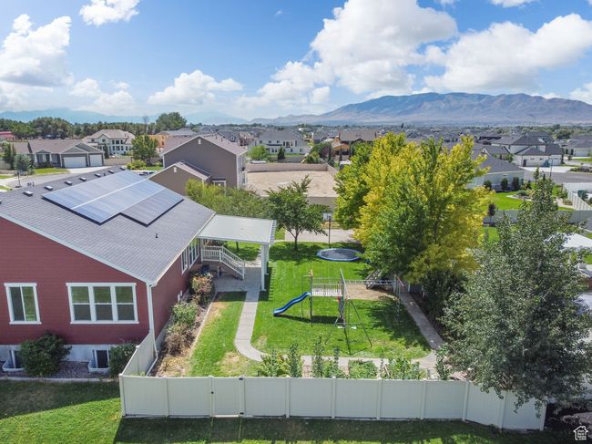 Aerial view of residential area featuring a mountainous background | Image 40