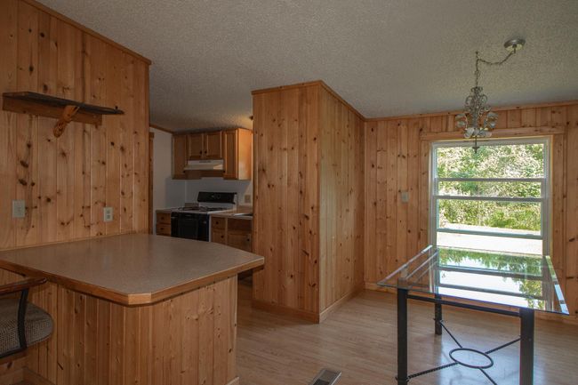 Island in Dining Room could be purposed as a serving or coffee bar or even a work area! | Image 13