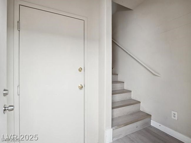 Staircase with wood finished floors and baseboards | Image 4