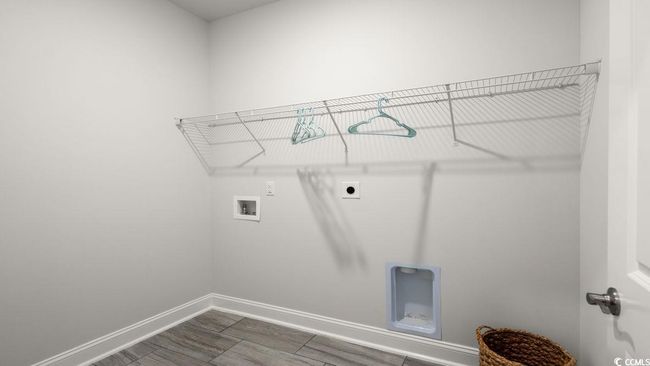 Washroom with hookup for an electric dryer, baseboards, washer hookup, and dark wood finished floors | Image 22
