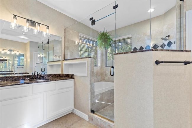 The primary bath features separate his-and-her vanities.The primary bath features separate his-and-her vanities, a massive walk-in shower. | Image 19