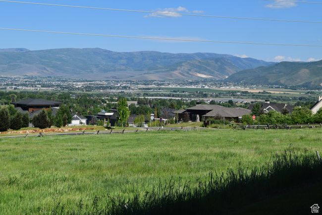 View of valley and mountains to the southeast from walkout deck off the main floor | Image 8