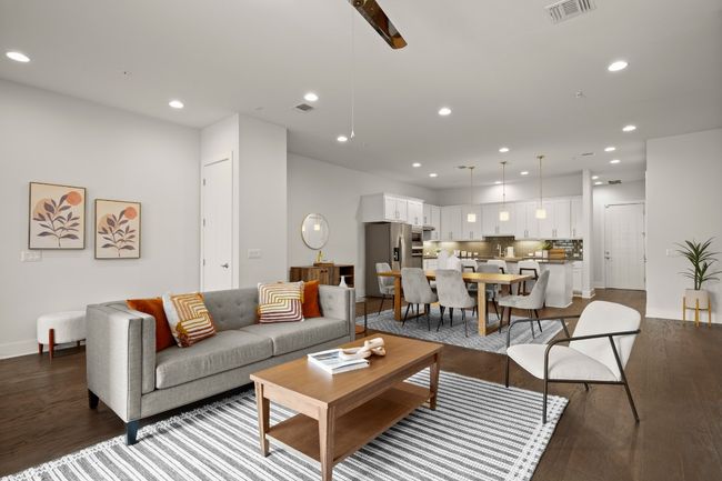 Living area with wood finished floors, recessed lighting, and baseboards | Image 6