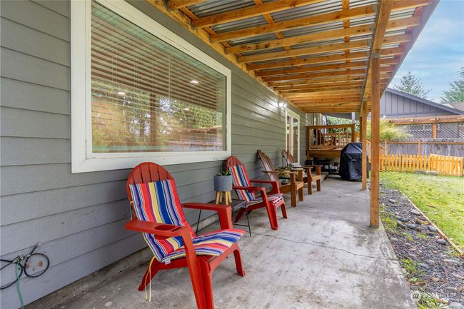 Back patio off basement looks out to your yard and water front | Image 28