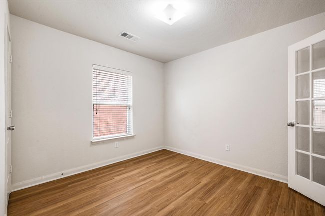 Unfurnished room with light wood-type flooring and baseboards | Image 16