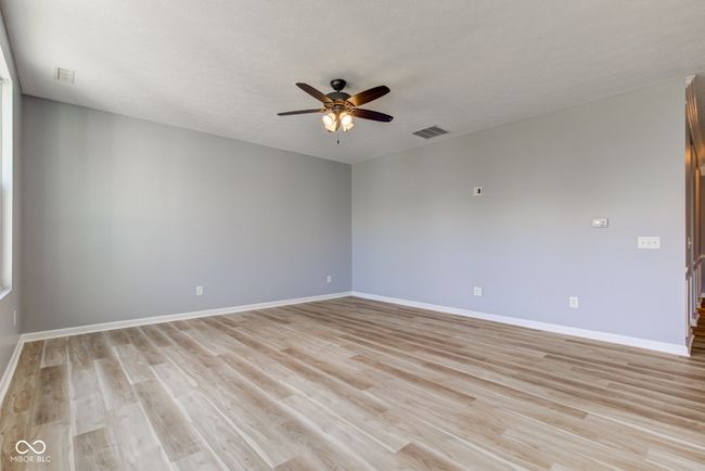 empty room featuring ceiling fan and light wood-type flooring | Image 22