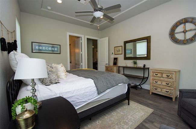 Another view of the primary bedroom with ceiling fan. | Image 15